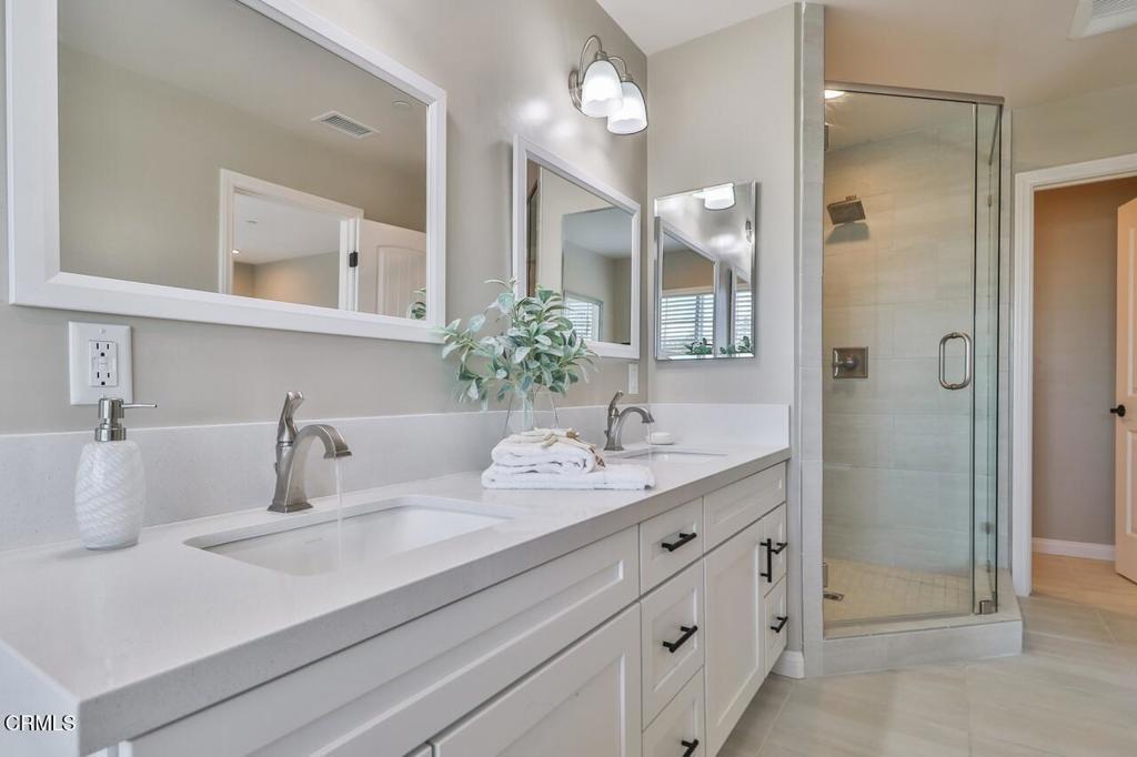 1030 Canal Street Oxnard, CA 93035 - Photo 18 of 26 a bathroom with a sink and a mirror