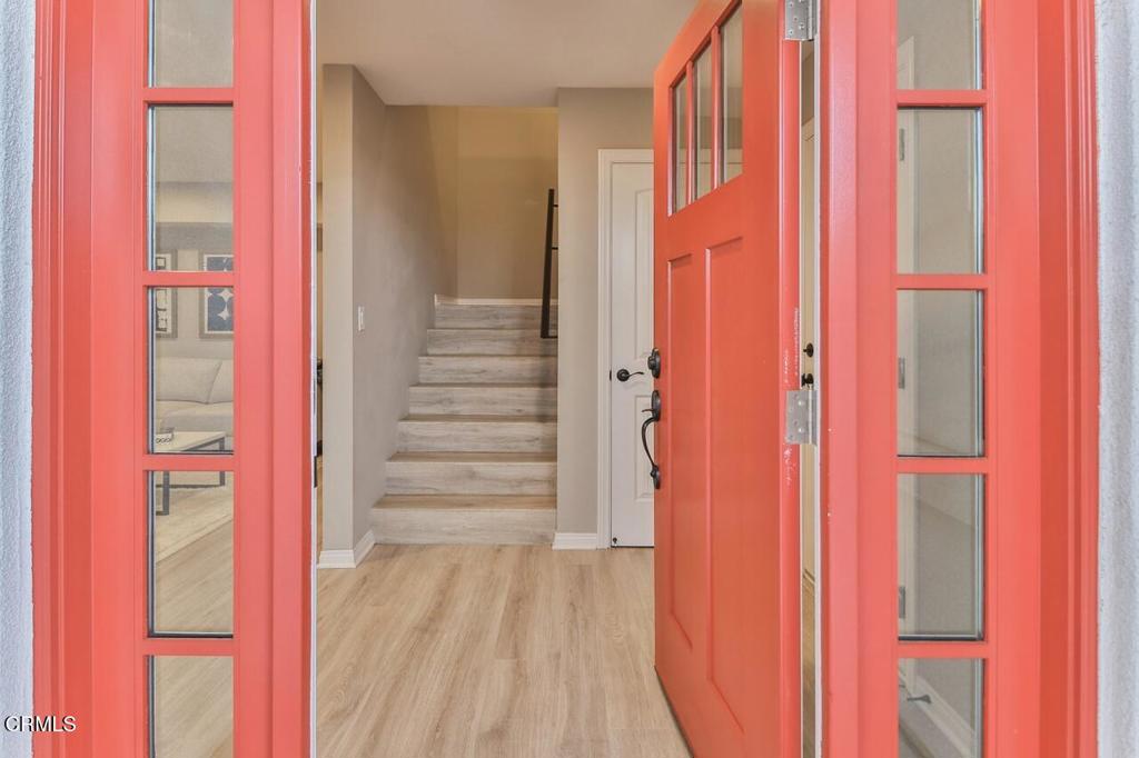 1030 Canal Street Oxnard, CA 93035 - Photo 2 of 26 a view of a hallway with wooden floor and staircase