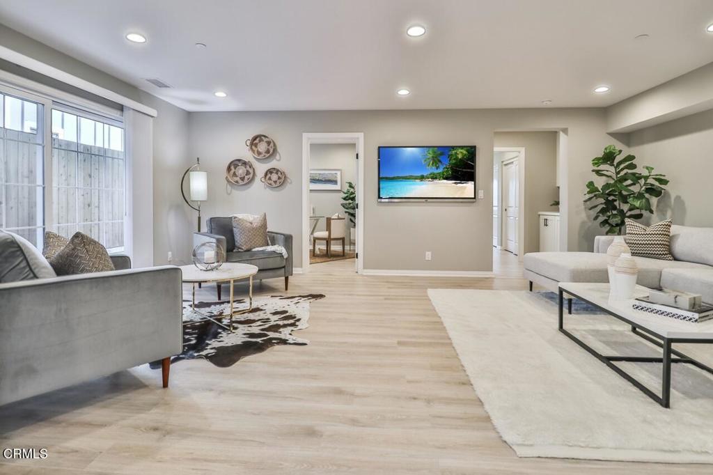 1030 Canal Street Oxnard, CA 93035 - Photo 3 of 26 a living room with furniture and wooden floor