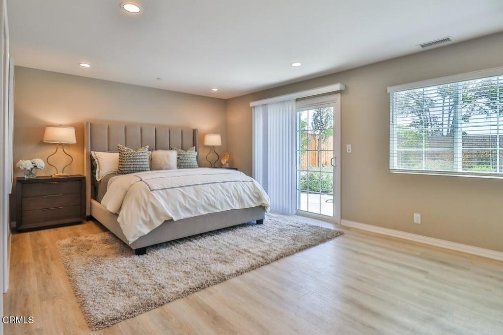 1030 Canal Street Oxnard, CA 93035 - Photo 5 of 26 a bedroom with a large bed and a window