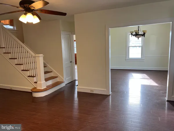 a view of an entryway with wooden floor