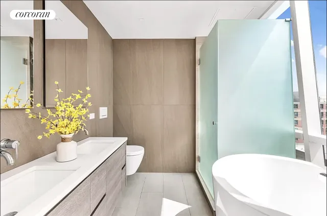 a bedroom with furniture and a large window