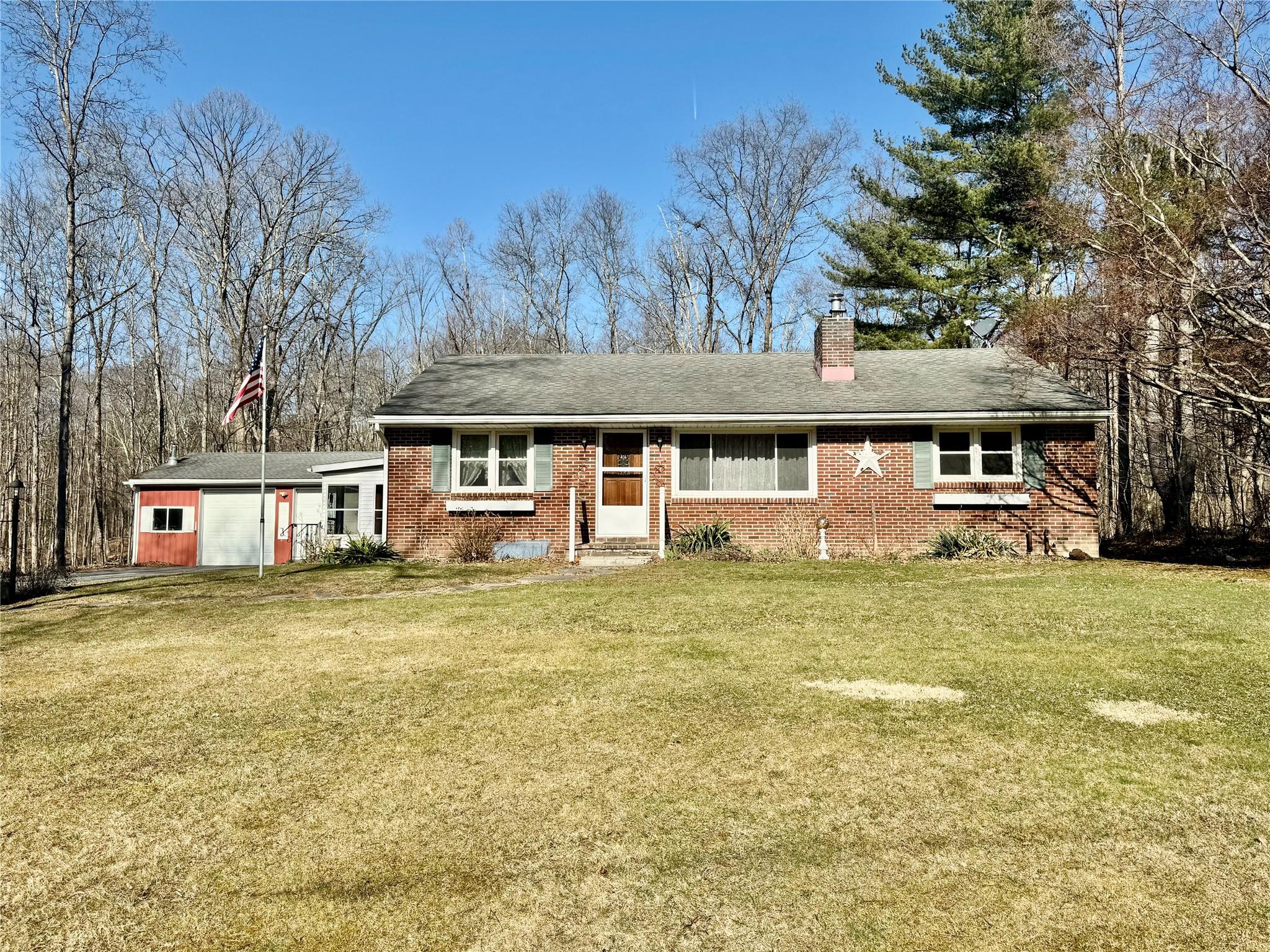 41 Schoolhouse Road Middletown, NY 10940 - Photo 1 of 1 Single story home with a front lawn, a chimney, and brick siding