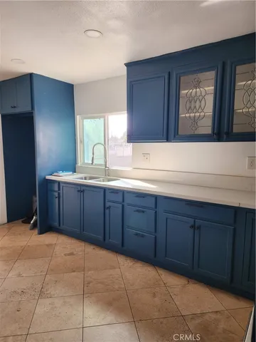 a spacious bathroom with a sink and a mirror