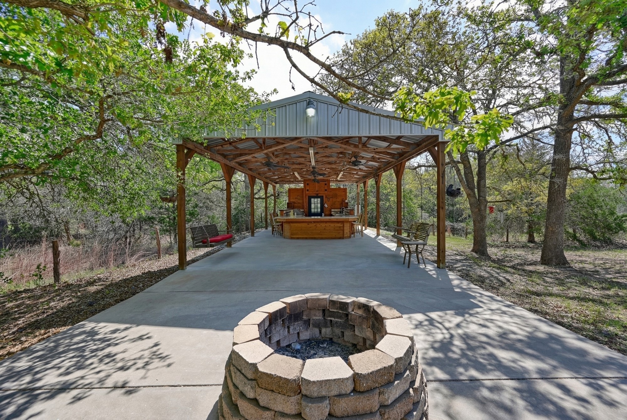 350 Owl Creek Road Giddings, TX 78942 - Photo 25 of 29 View of patio with a fire pit and an outdoor bar