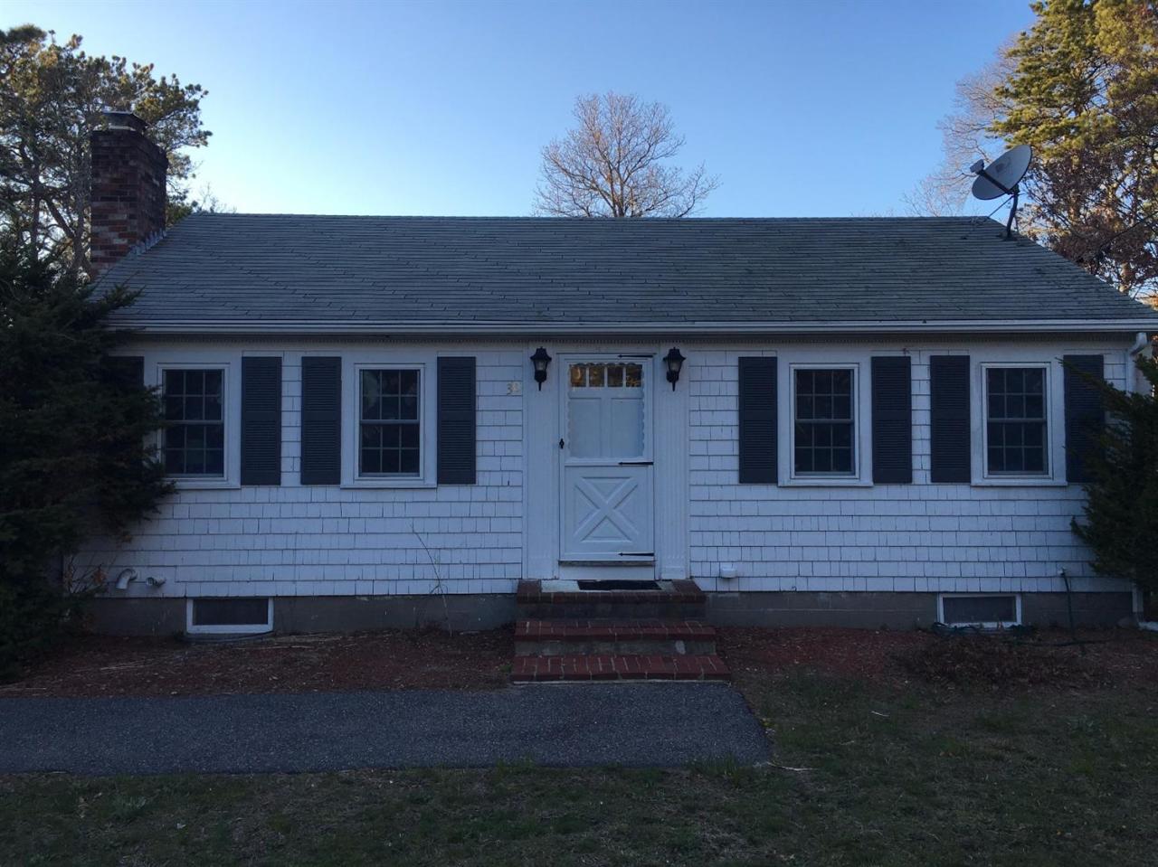 30 Skating Rink Road Hyannis, MA 02601 - Photo 1 of 10 a front view of a house with a garden