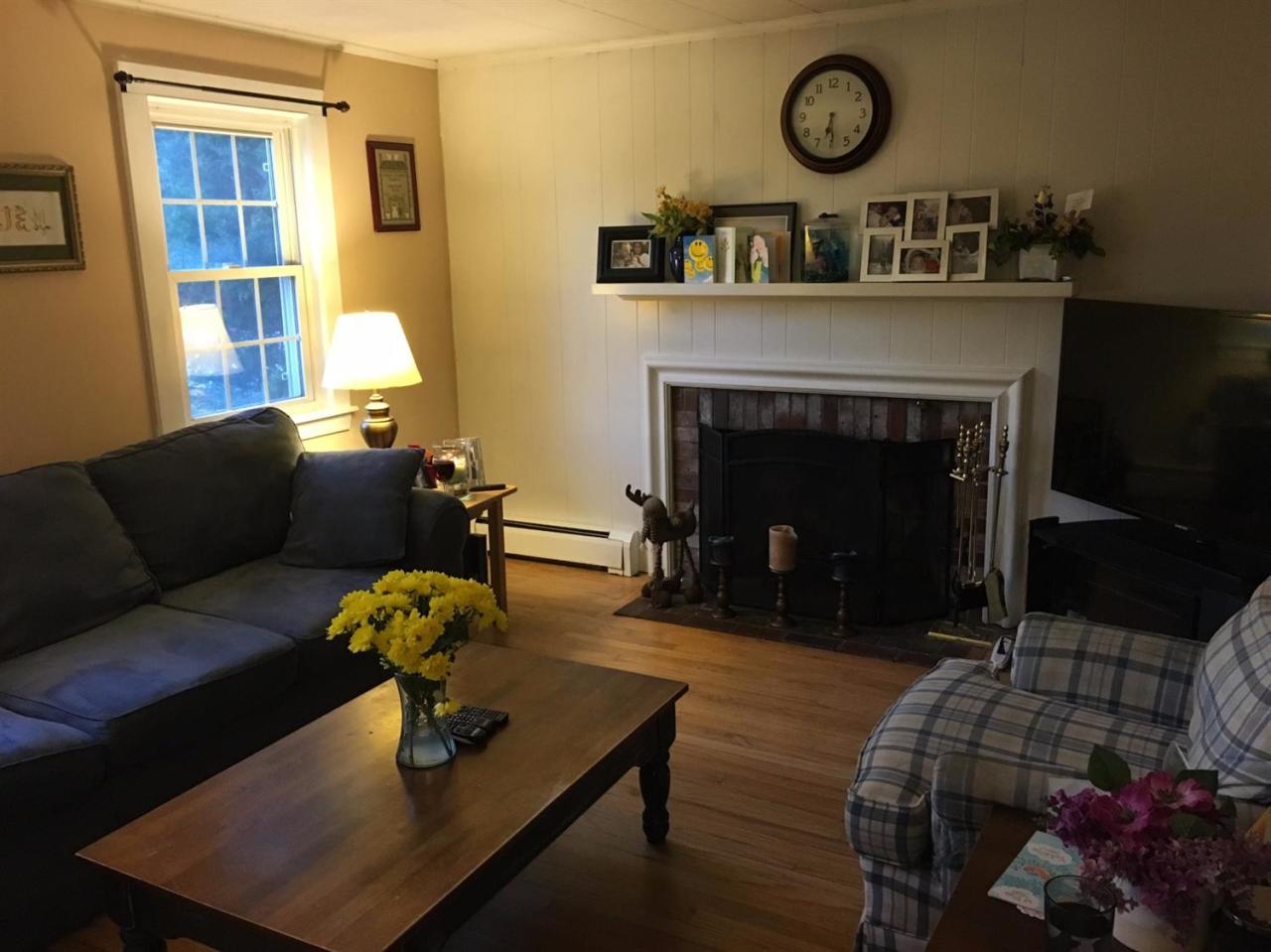 30 Skating Rink Road Hyannis, MA 02601 - Photo 2 of 10 a living room with furniture a fireplace and a window