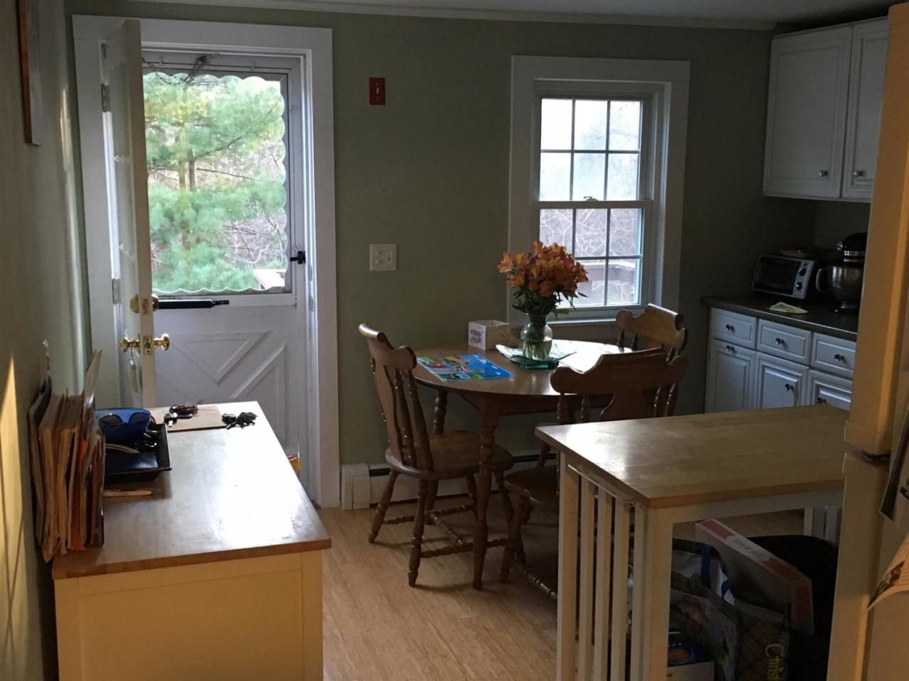 30 Skating Rink Road Hyannis, MA 02601 - Photo 6 of 10 a kitchen with a table chairs and a refrigerator