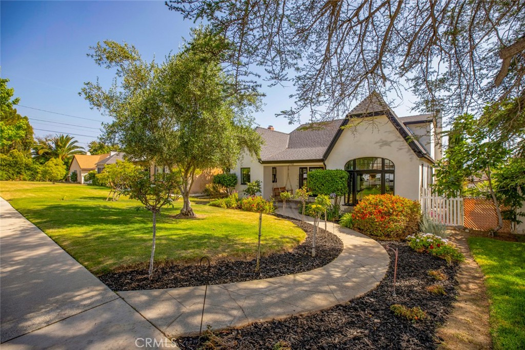 a front view of a house with garden