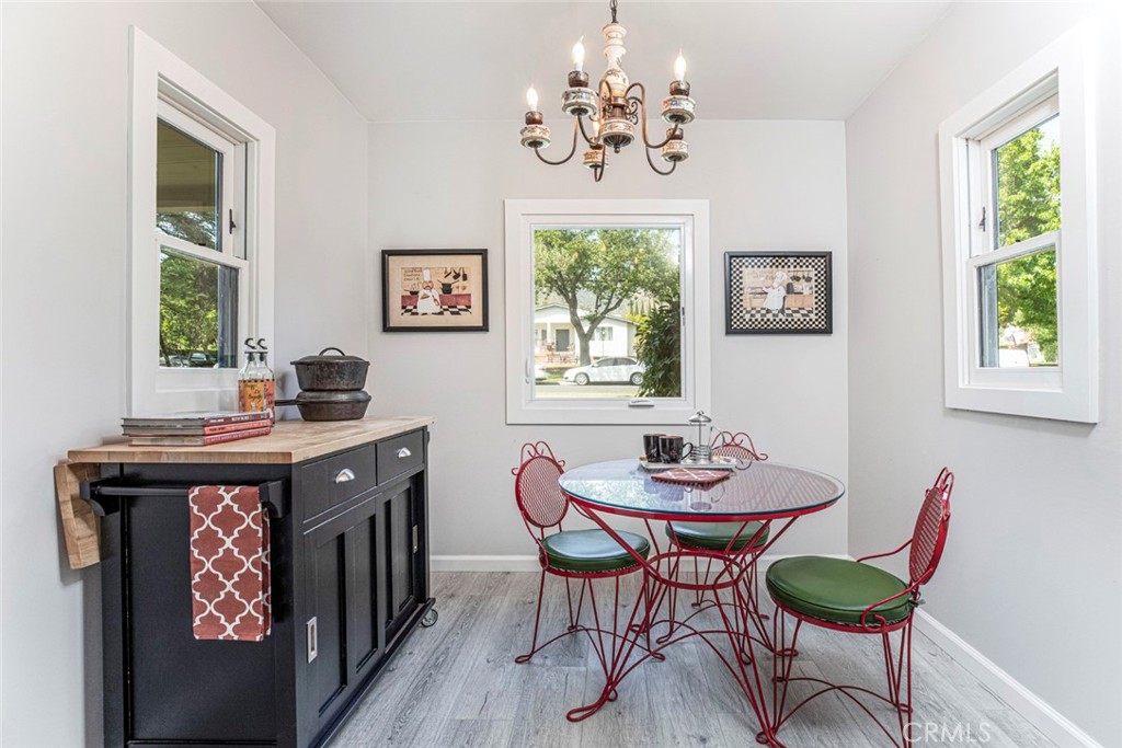 1748 Bel Aire Drive Glendale, CA 91201 - Photo 17 of 51 a view of a dining room with furniture window and wooden floor
