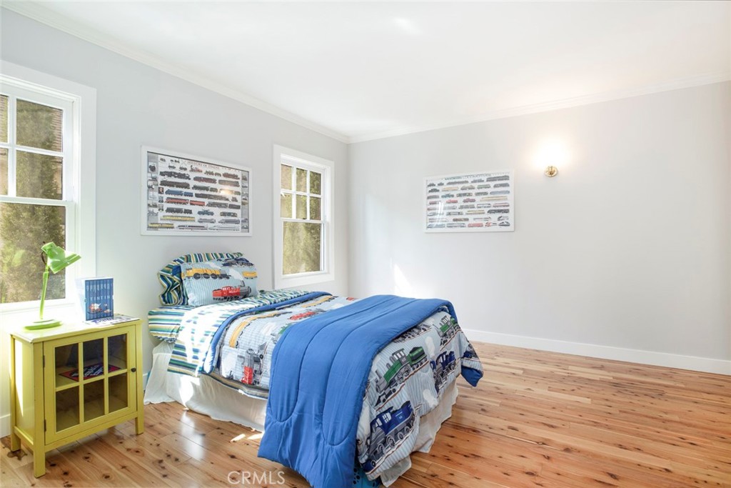 1748 Bel Aire Drive Glendale, CA 91201 - Photo 21 of 51 a bedroom with a bed and a window