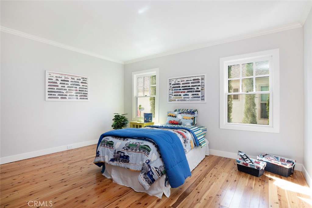 1748 Bel Aire Drive Glendale, CA 91201 - Photo 22 of 51 a bedroom with a bed and wooden floor