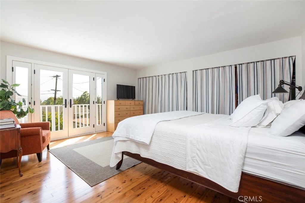 1748 Bel Aire Drive Glendale, CA 91201 - Photo 24 of 51 a bed sitting in a bedroom next to a large window