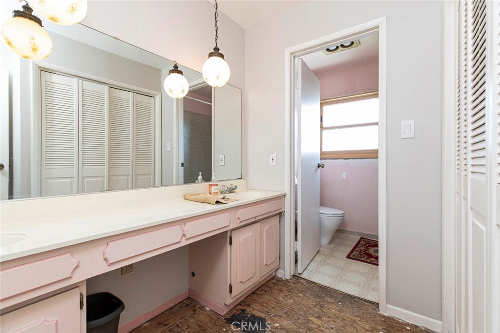 1748 Bel Aire Drive Glendale, CA 91201 - Photo 27 of 51 a bathroom with a sink and a mirror