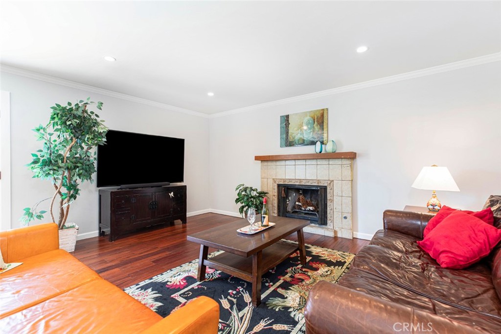 1748 Bel Aire Drive Glendale, CA 91201 - Photo 30 of 51 a living room with furniture a flat screen tv and a fireplace