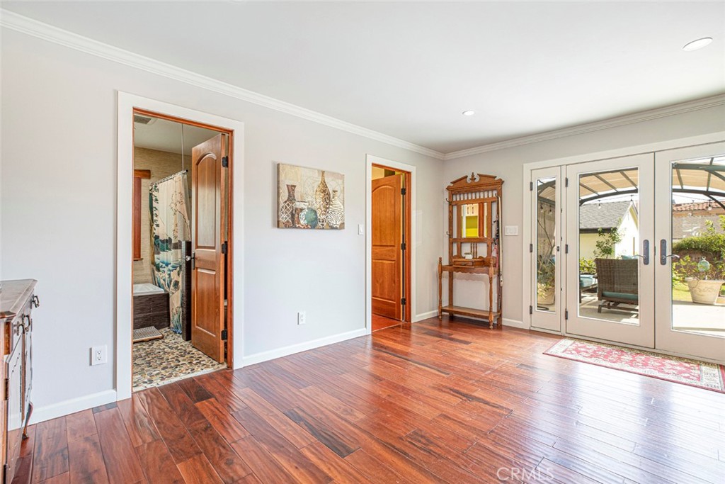 1748 Bel Aire Drive Glendale, CA 91201 - Photo 32 of 51 an empty room with wooden floor and windows