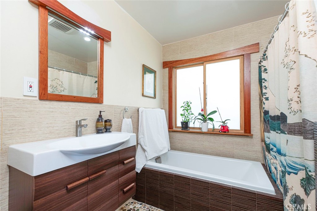 1748 Bel Aire Drive Glendale, CA 91201 - Photo 33 of 51 a bathroom with a sink mirror and a bathtub