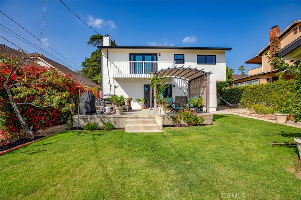 1748 Bel Aire Drive Glendale, CA 91201 - Photo 35 of 51 a view of a house with patio and a yard