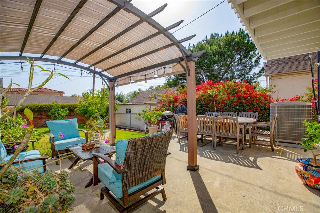 1748 Bel Aire Drive Glendale, CA 91201 - Photo 38 of 51 a view of a patio with table and chairs potted plants