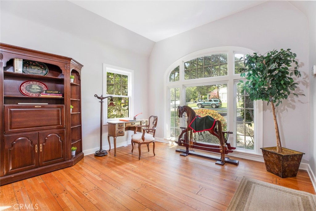 1748 Bel Aire Drive Glendale, CA 91201 - Photo 6 of 51 a living room with furniture gym equipment and large windows
