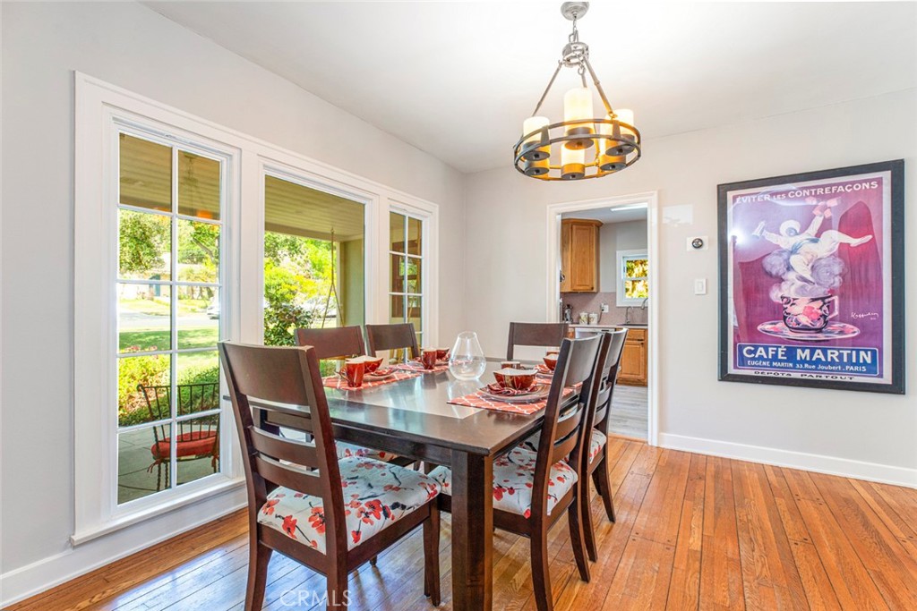 1748 Bel Aire Drive Glendale, CA 91201 - Photo 10 of 51 a dining room with furniture a chandelier and wooden floor
