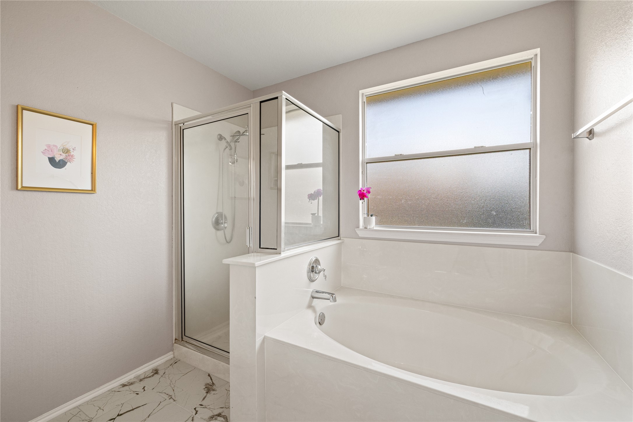 20105 Harrier Flight Trail Pflugerville, TX 78660 - Photo 16 of 35 Full bath with a stall shower, a bath, and light tile floors