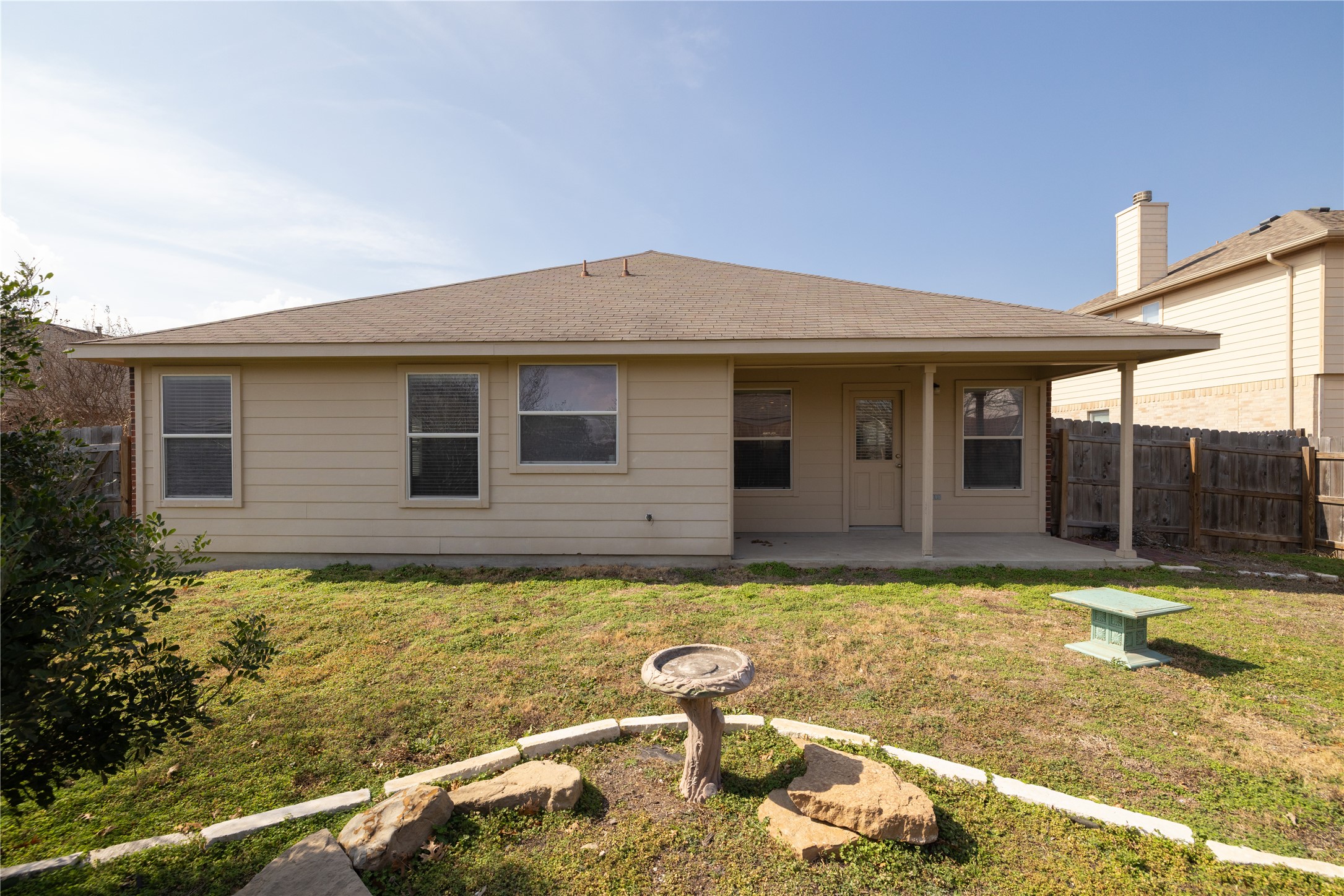 20105 Harrier Flight Trail Pflugerville, TX 78660 - Photo 25 of 35 Back of property featuring a patio area, a shingled roof, and a fenced backyard