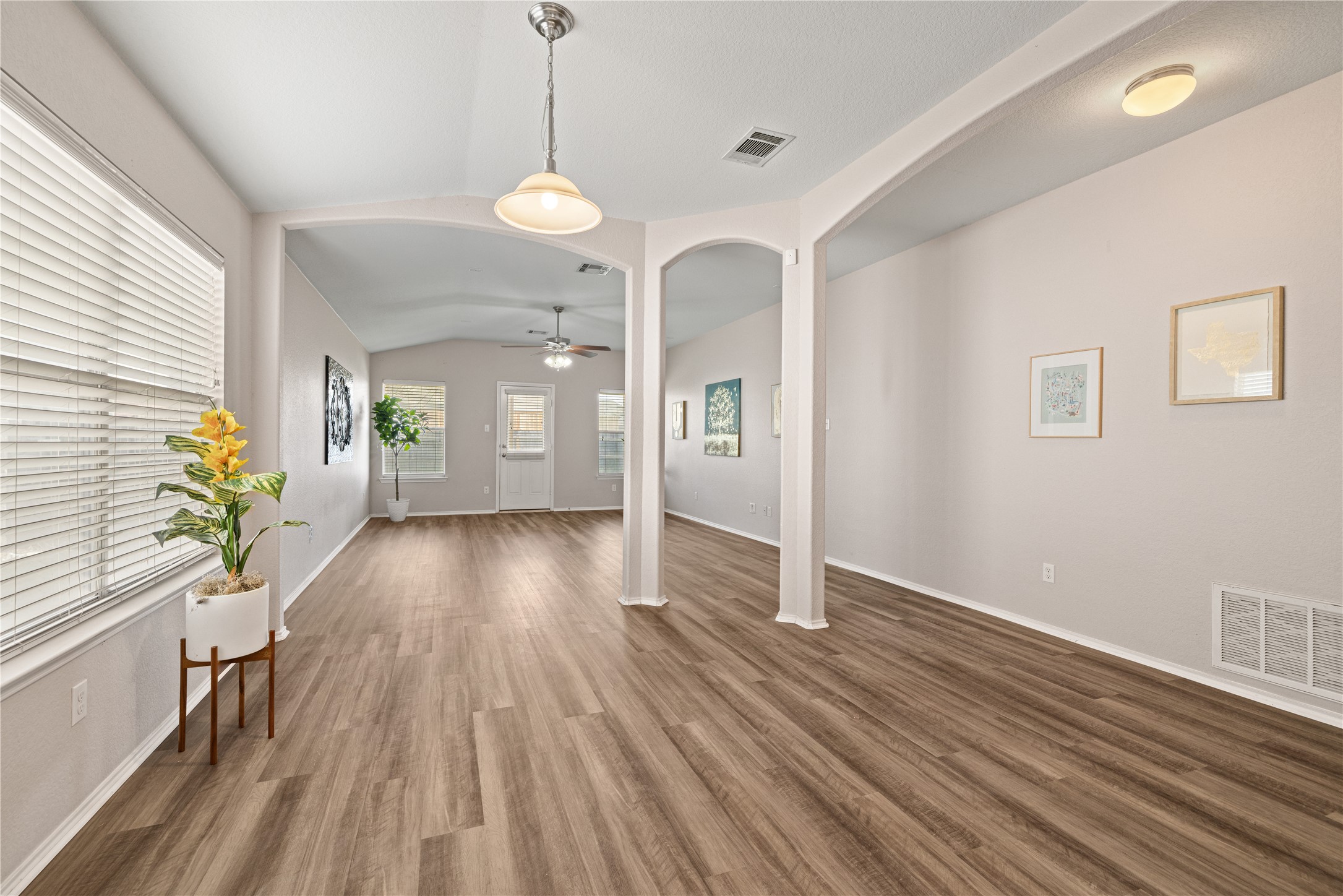 20105 Harrier Flight Trail Pflugerville, TX 78660 - Photo 7 of 35 Entryway featuring wood finished floors, lofted ceiling, and ceiling fan
