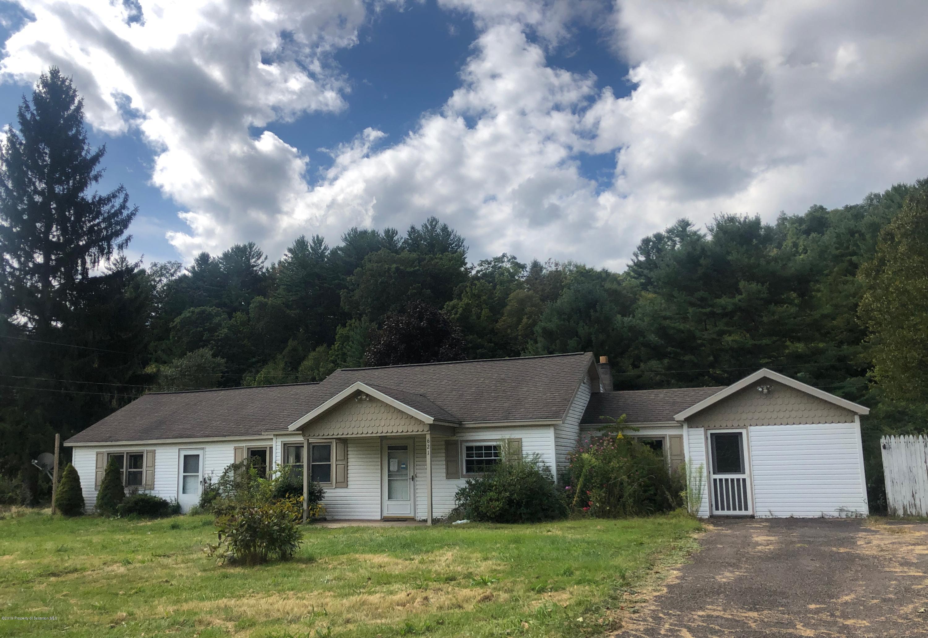 621 Randolph Road Great Bend, PA 18821 - Photo 1 of 11 a front view of a house with garden