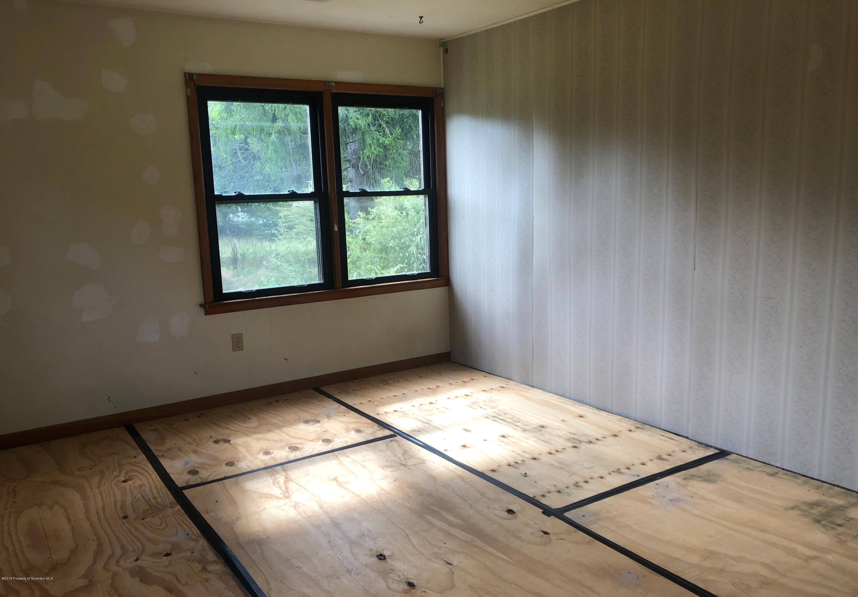 621 Randolph Road Great Bend, PA 18821 - Photo 2 of 11 a view of an empty room and window