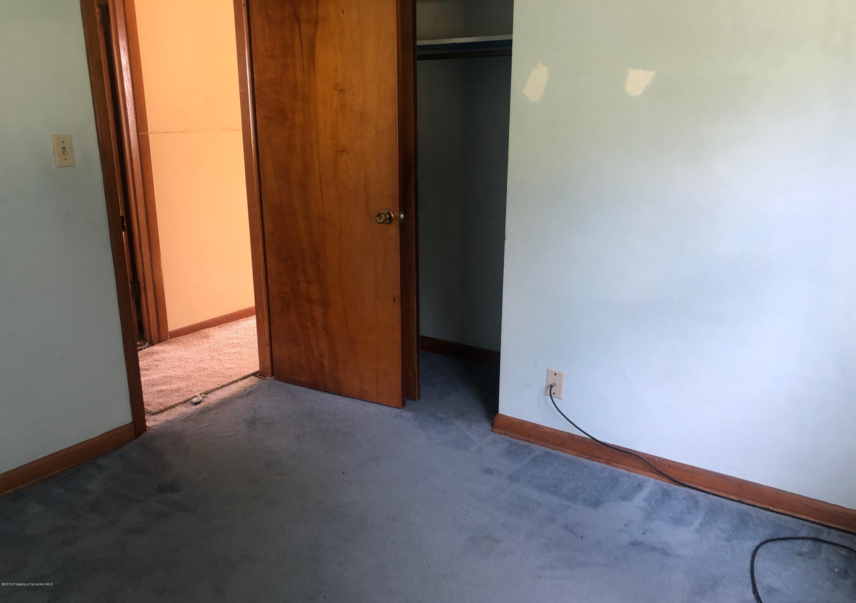 621 Randolph Road Great Bend, PA 18821 - Photo 4 of 11 an empty room with windows