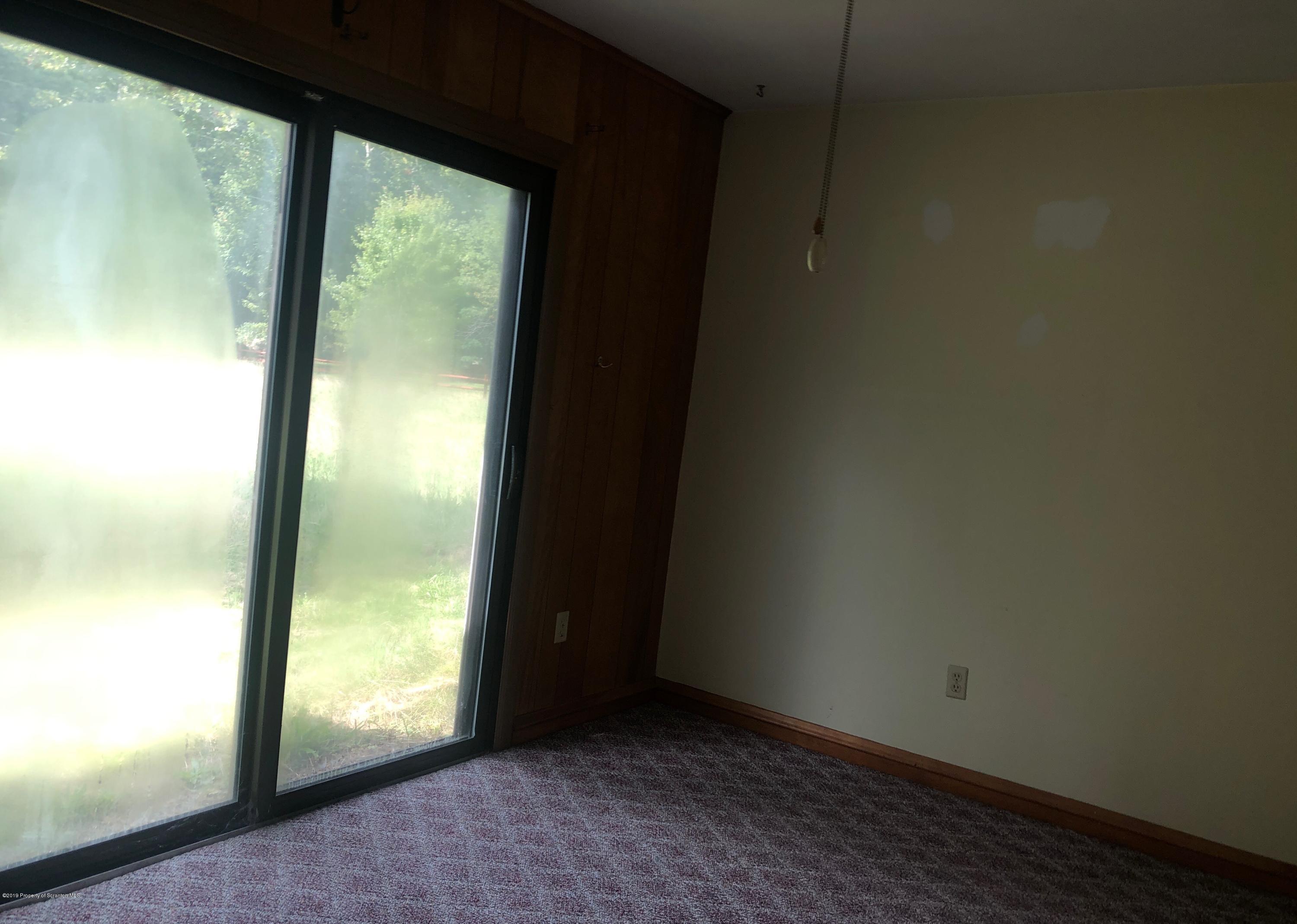 621 Randolph Road Great Bend, PA 18821 - Photo 6 of 11 a view of an empty room and window