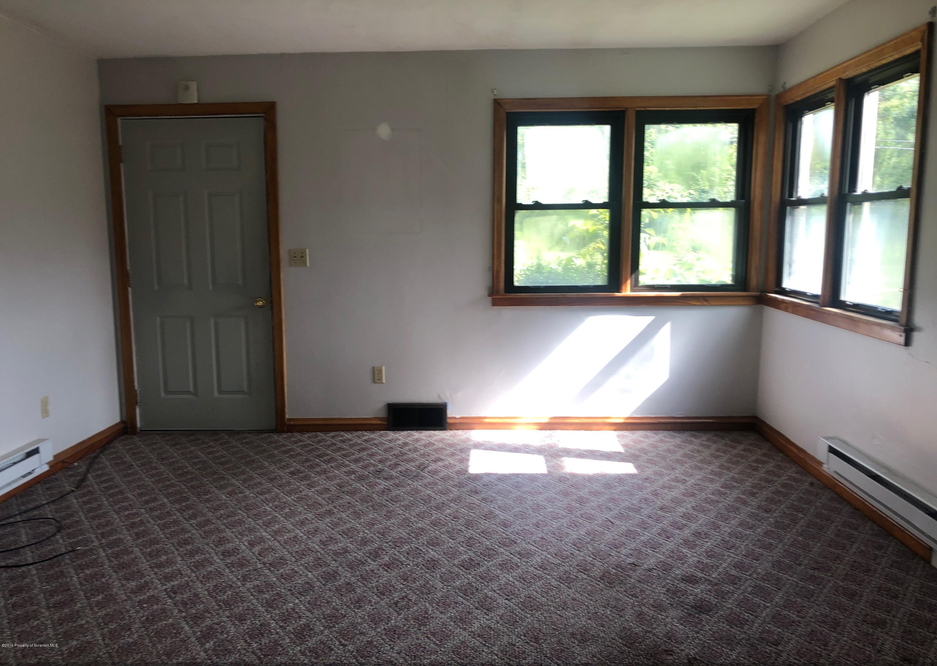 621 Randolph Road Great Bend, PA 18821 - Photo 7 of 11 an empty room with windows