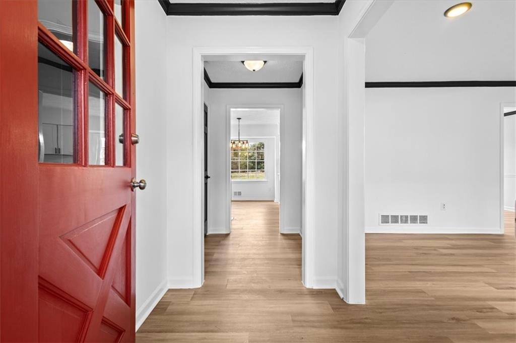 7605 Raleigh Lane Jonesboro, GA 30236 - Photo 11 of 40 a view of an entryway with wooden floor