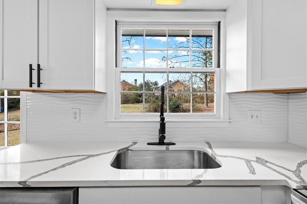 7605 Raleigh Lane Jonesboro, GA 30236 - Photo 20 of 40 a kitchen sink with a window