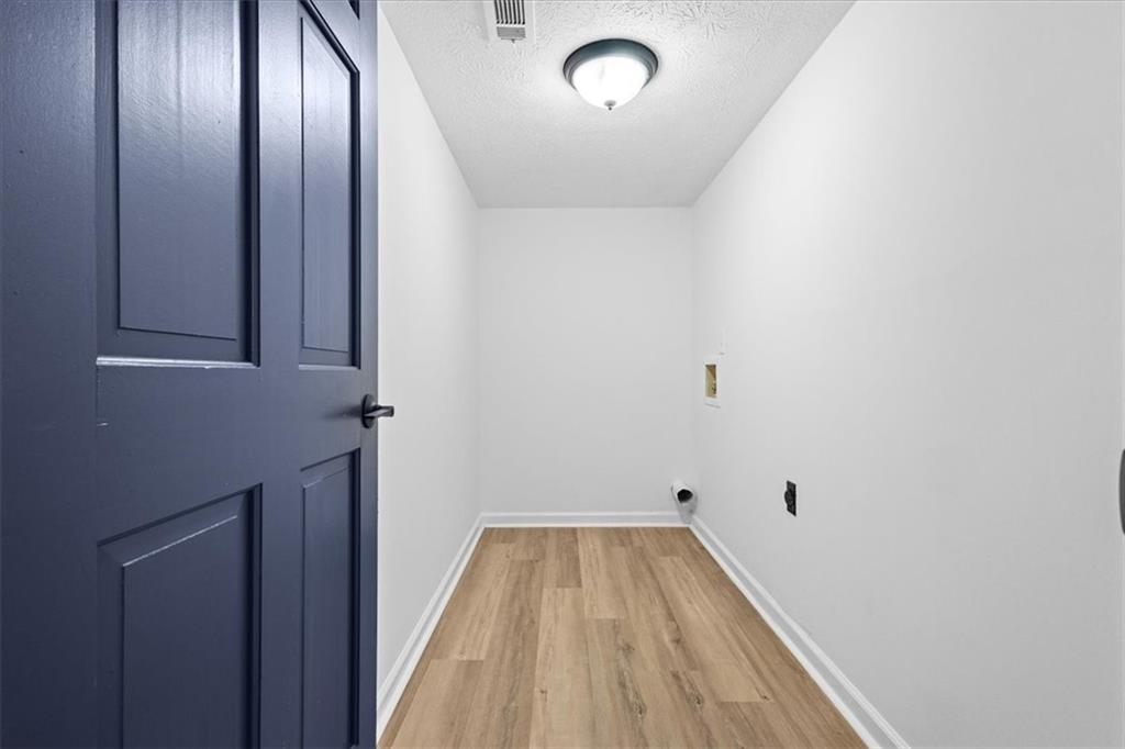 7605 Raleigh Lane Jonesboro, GA 30236 - Photo 23 of 40 a view of empty room with wooden floor
