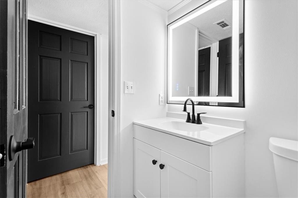 7605 Raleigh Lane Jonesboro, GA 30236 - Photo 25 of 40 a bathroom with a sink and a mirror