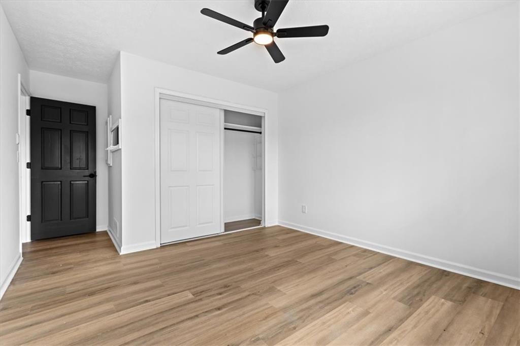7605 Raleigh Lane Jonesboro, GA 30236 - Photo 36 of 40 wooden floor in an empty room