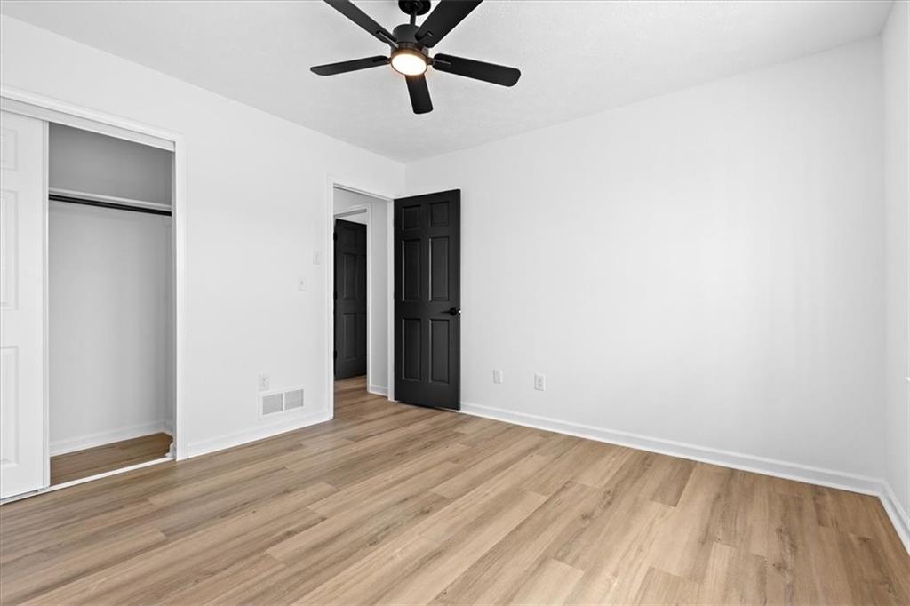 7605 Raleigh Lane Jonesboro, GA 30236 - Photo 38 of 40 a view of an empty room with wooden floor