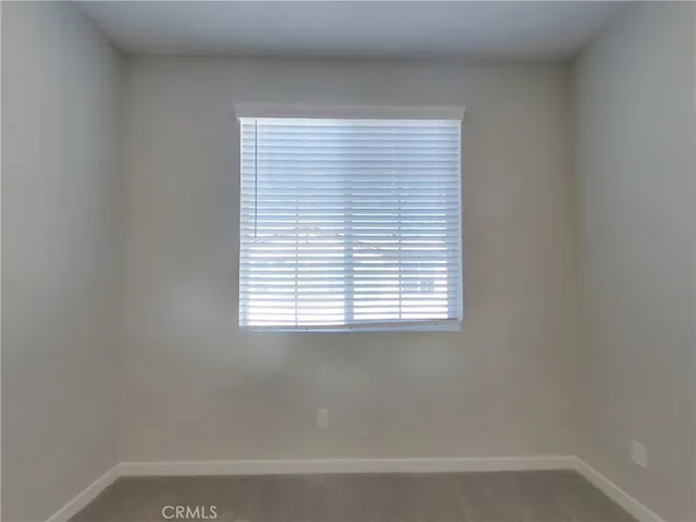 a bathroom with a bathtub and a window