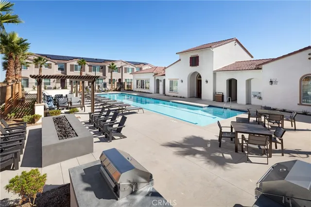 a living room with furniture a rug and a chandelier