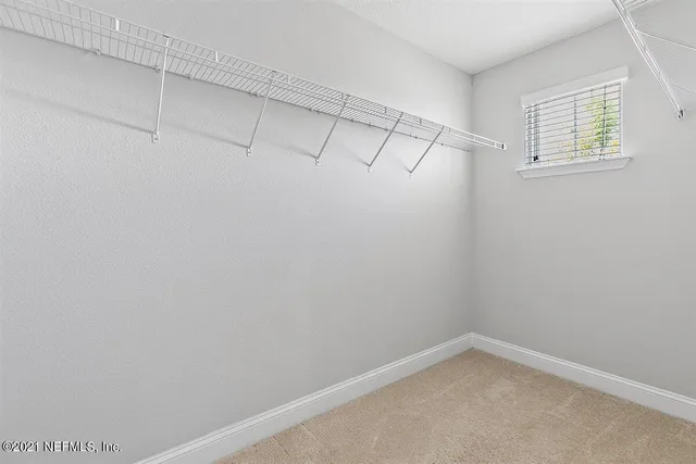 a view of a room with racks on the wall