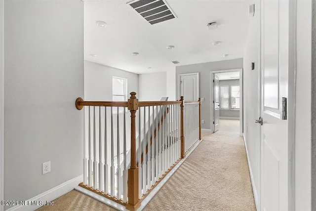 a view of a hallway with a window