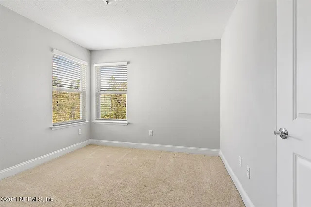a big room with windows and closet