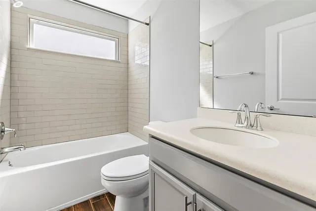 a bathroom with a sink a toilet and a bathtub