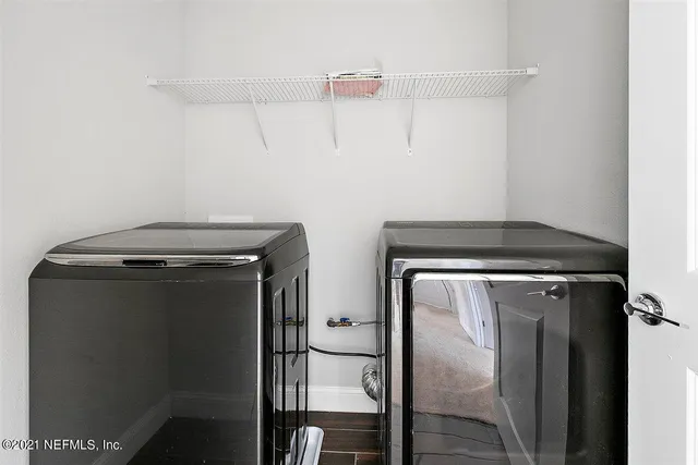 a utility room with dryer and washer