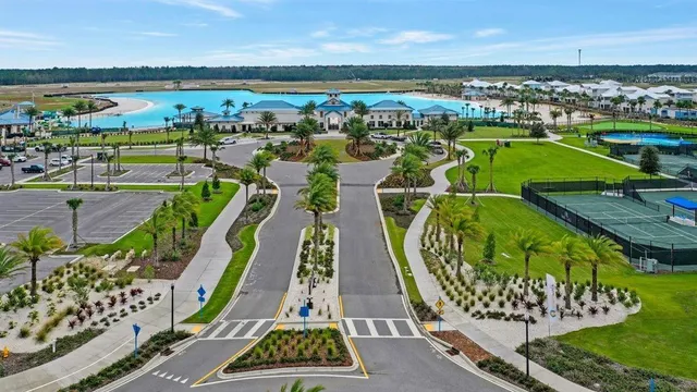 a front view of houses with yard