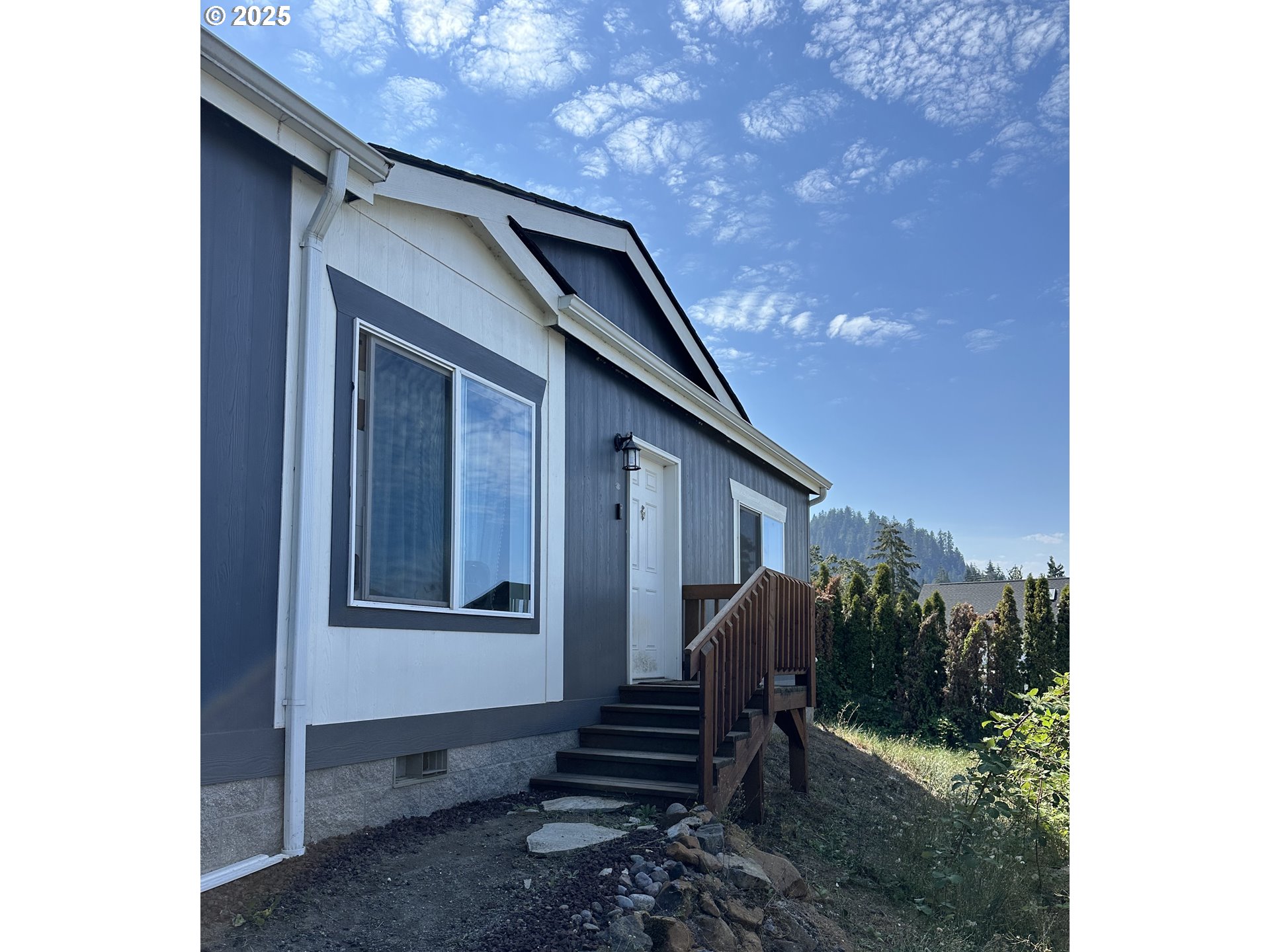 466 South 71st Street Springfield, OR 97478 - Photo 1 of 33 a view of a house with a yard and stairs