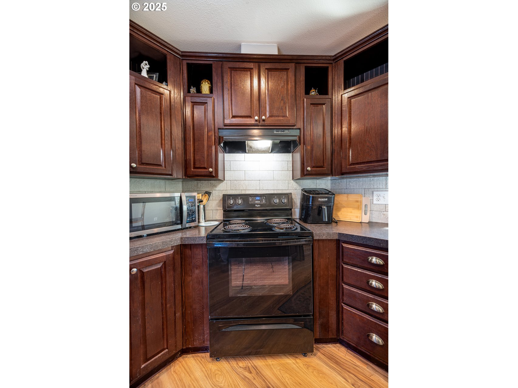 466 South 71st Street Springfield, OR 97478 - Photo 12 of 33 a kitchen with a stove and a cabinet