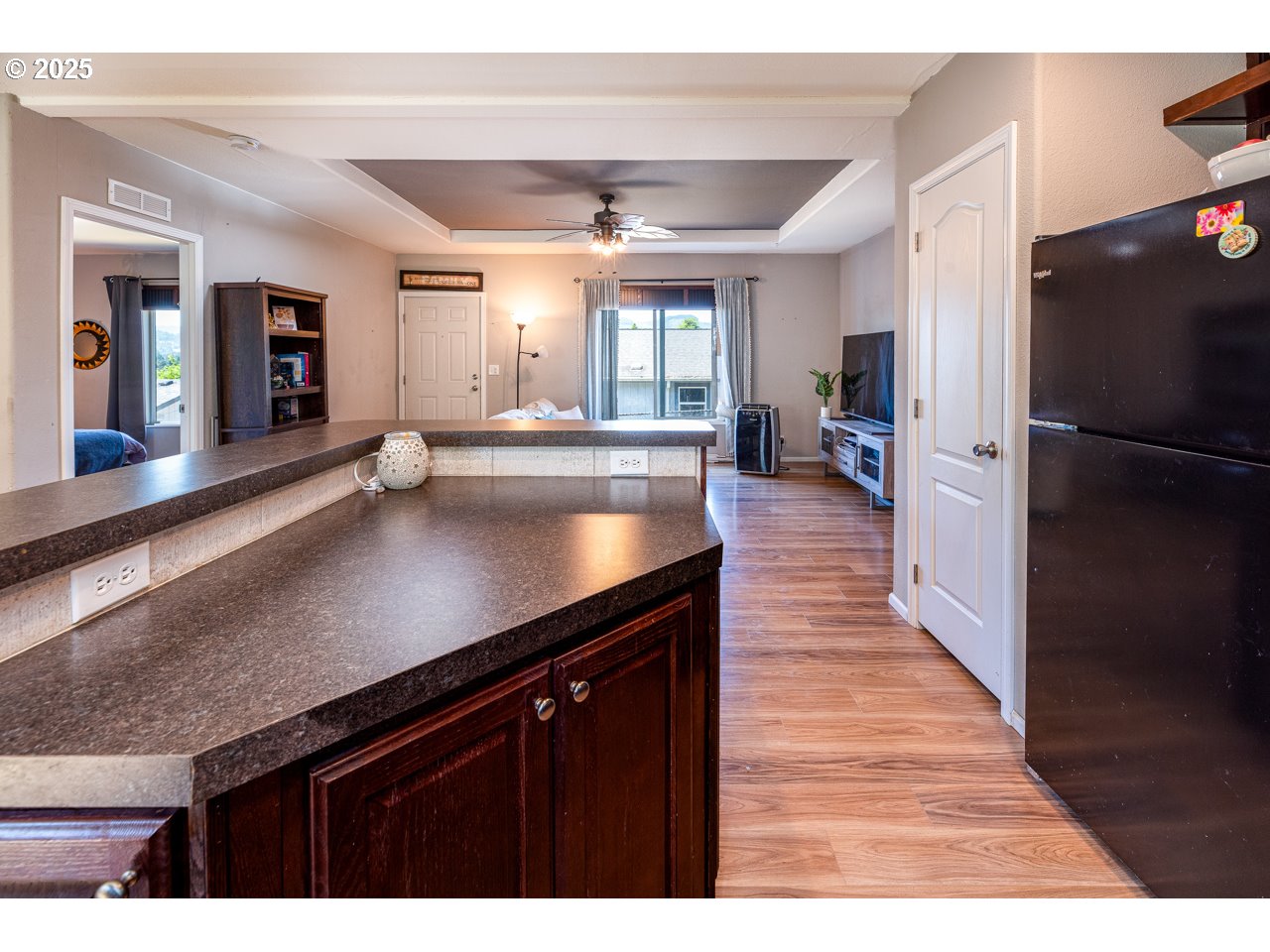 466 South 71st Street Springfield, OR 97478 - Photo 14 of 33 a kitchen with counter top space a sink wooden floor and stainless steel appliances